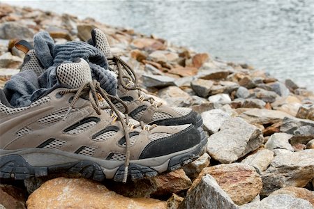 simsearch:400-07550529,k - Shoes and sock on the rocks near a mountain lake Photographie de stock - Aubaine LD & Abonnement, Code: 400-05242067
