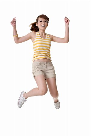 Happy girl jump, full length portrait isolated on white background. Photographie de stock - Aubaine LD & Abonnement, Code: 400-05242374