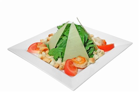 Caesar salad with fried shrimps and triangular slices of parmesan. Isolated on white. Stock Photo - Budget Royalty-Free & Subscription, Code: 400-05242392
