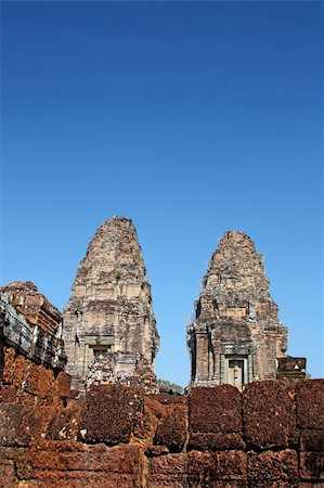 simsearch:400-04466118,k - Temple Towers in Angkor. Ancient Khmer city in Cambodia. UNESCO world heritage site Fotografie stock - Microstock e Abbonamento, Codice: 400-05242409