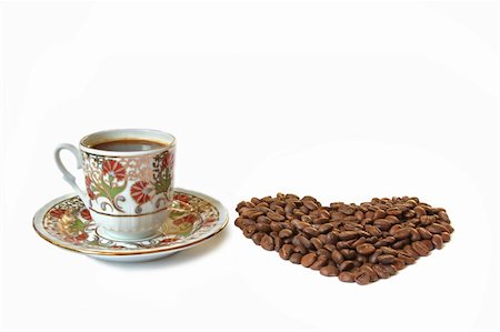 simsearch:628-02615924,k - A cup of coffee and heart shaped coffee beans. Isolated on white Foto de stock - Royalty-Free Super Valor e Assinatura, Número: 400-05242412