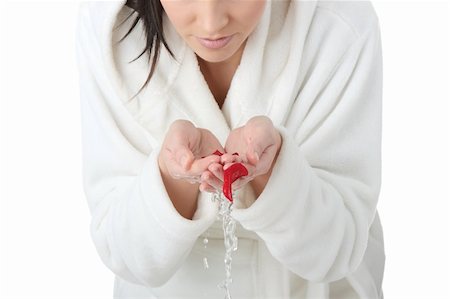 simsearch:400-04659363,k - Beautiful young woman with hands in water, with rose petals in water, isolated on white Stock Photo - Budget Royalty-Free & Subscription, Code: 400-05243320