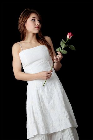 simsearch:400-04323317,k - Beautiful young woman in white dress with rose Stock Photo - Budget Royalty-Free & Subscription, Code: 400-05243335