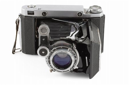 simsearch:400-04527928,k - Old folding camera isolated on white background Foto de stock - Super Valor sin royalties y Suscripción, Código: 400-05243742