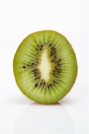 Close up of Kiwi fruit on white background. Photographie de stock - Aubaine LD & Abonnement, Code: 400-05243921