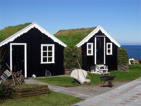 Traditional black grass-roof country houses at the sea shore in the Northern part of Iceland Stock Photo - Budget Royalty-Free & Subscription, Code: 400-05254186