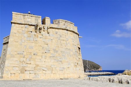Moraira Teulada Alicante Castle Mediterranean coast blue sea sky Photographie de stock - Aubaine LD & Abonnement, Code: 400-05254300