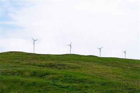 energy power ecology resources, wind turbines on a distant hill horizon Fotografie stock - Microstock e Abbonamento, Codice: 400-05254695