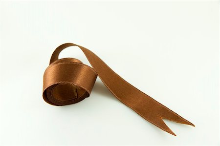 Brown satin ribbon isolated on white background Photographie de stock - Aubaine LD & Abonnement, Code: 400-05255184