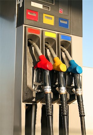 petroleum pump station car - Gas nozzles at the gas station A row of 3 different gas pumps red yellow and blue Stock Photo - Budget Royalty-Free & Subscription, Code: 400-05255598