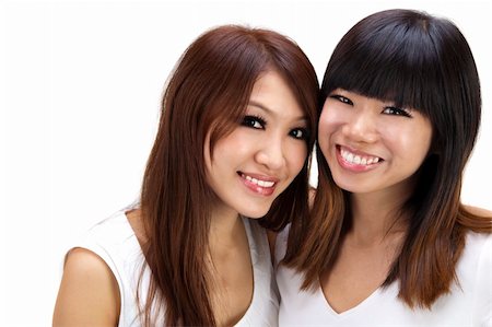 Two Asian best friend smiling on white background Stock Photo - Budget Royalty-Free & Subscription, Code: 400-05256069