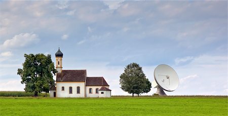 An image of a nice church with satellite dish in bavaria germany Stock Photo - Budget Royalty-Free & Subscription, Code: 400-05257966