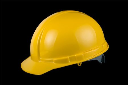 simsearch:400-04429200,k - Yellow helmet isolated on black background Stock Photo - Budget Royalty-Free & Subscription, Code: 400-05258789