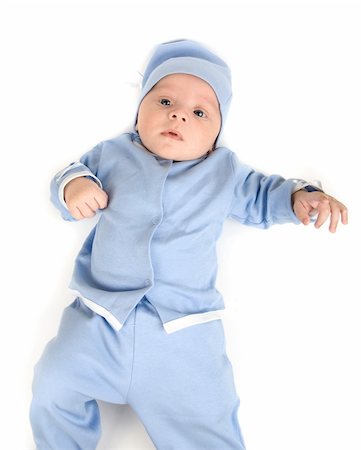 simsearch:400-07211187,k - Lying baby boy at blue on a white background Photographie de stock - Aubaine LD & Abonnement, Code: 400-05258795