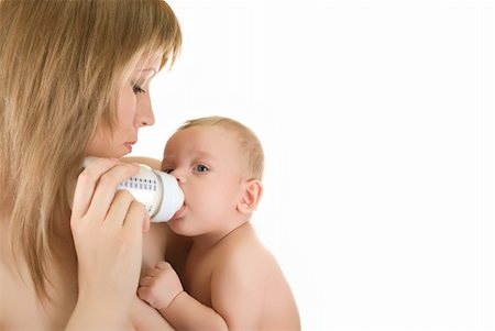 simsearch:400-06073989,k - Mommy give drink her baby boy by feeding bottle over white Photographie de stock - Aubaine LD & Abonnement, Code: 400-05258814