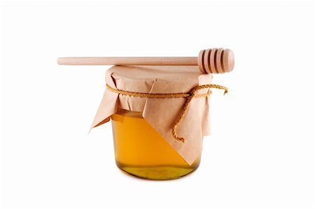 Honey in jar wooden spoon isolated white. Stockbilder - Microstock & Abonnement, Bildnummer: 400-05258916