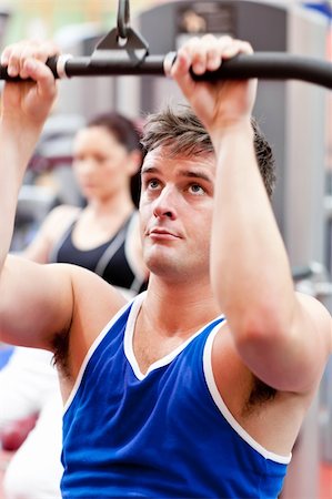 simsearch:400-05677914,k - Male athlete practicing body-building in a fitness center Stock Photo - Budget Royalty-Free & Subscription, Code: 400-05259226