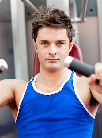 simsearch:400-04256139,k - Charming athletic man using a bench press in a fitness center Stock Photo - Budget Royalty-Free & Subscription, Code: 400-05259221