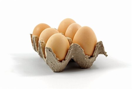 simsearch:400-05383364,k - Eggs on a tray against white background Photographie de stock - Aubaine LD & Abonnement, Code: 400-05259474