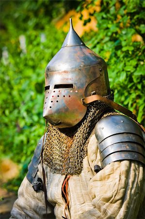 man in knight's helmet on a green background Stock Photo - Budget Royalty-Free & Subscription, Code: 400-05259895