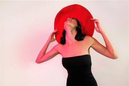 simsearch:400-04542798,k - Portrait of young fashionable woman wearing red hat isolated on white Foto de stock - Super Valor sin royalties y Suscripción, Código: 400-05250183
