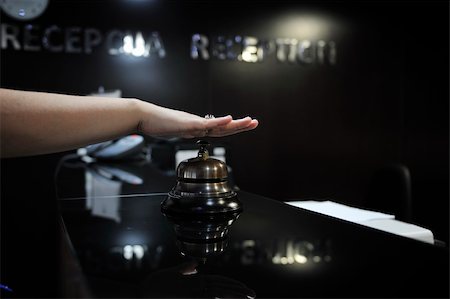 woman hand pressing reception bell in 4 stars hotel Stock Photo - Budget Royalty-Free & Subscription, Code: 400-05250510