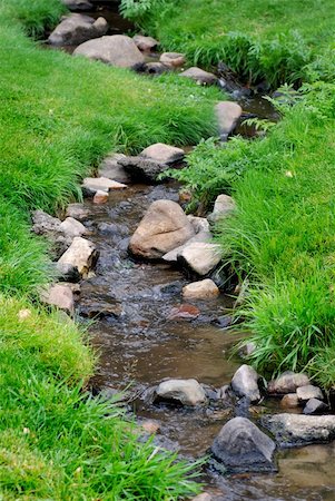 simsearch:400-04923181,k - River water flowing past rocks and stones in green meadow Photographie de stock - Aubaine LD & Abonnement, Code: 400-05250727