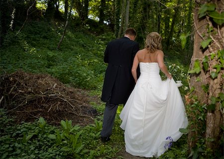 romantic bride and groom walking  in bluebell woods shot from behind Stock Photo - Budget Royalty-Free & Subscription, Code: 400-05251990