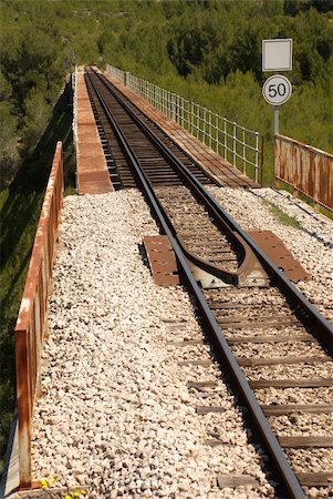 steel beams and girders - Railway track crossing a valley on a bridge Stock Photo - Budget Royalty-Free & Subscription, Code: 400-05252018