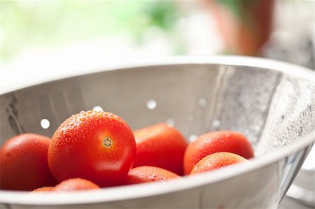 simsearch:700-00605469,k - Macro of Fresh, Vibrant Roma Tomatoes in Colander with Water Drops Abstract. Photographie de stock - Aubaine LD & Abonnement, Code: 400-05252455