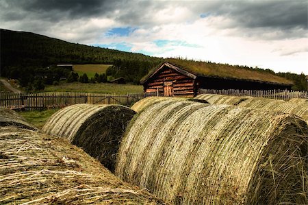 old wooden house with the straw bales Stock Photo - Budget Royalty-Free & Subscription, Code: 400-05252489