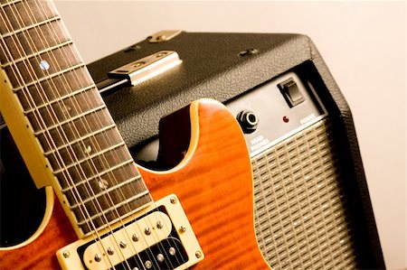 rock speakers - close up of electric guitar and amplifier isolated on white background Foto de stock - Super Valor sin royalties y Suscripción, Código: 400-05252506