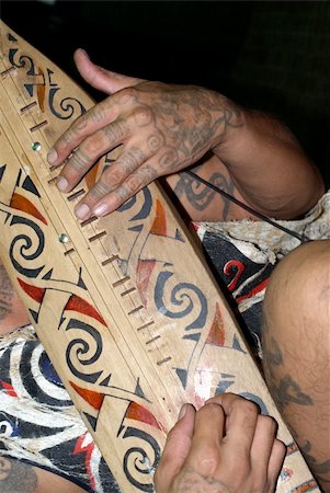 sarawak - sape an orangulu traditional and unique music instrument, guitar like with colourful decoration of orangulu motif design.Orangulu is a minor ethnic group living in sarawak Malaysia Stock Photo - Budget Royalty-Free & Subscription, Code: 400-05252567