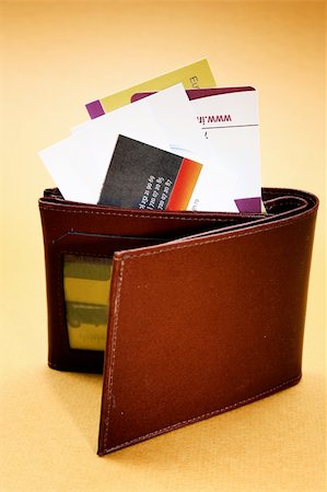 simsearch:695-03386967,k - Brown leather wallet isolated on yellow Stock Photo - Budget Royalty-Free & Subscription, Code: 400-05252652