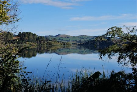 Early morning reflection on lake - North Island - New Zealand Stock Photo - Budget Royalty-Free & Subscription, Code: 400-05252721