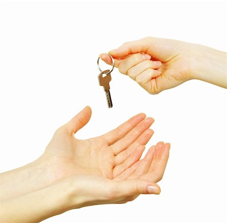 simsearch:400-04663994,k - hand holds a key isolated on white Photographie de stock - Aubaine LD & Abonnement, Code: 400-05252852