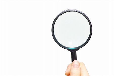 detective at the crime scene - hand holding a magnifying glass on white Stock Photo - Budget Royalty-Free & Subscription, Code: 400-05252864