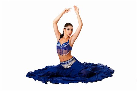 simsearch:400-05252988,k - Beautiful Israeli Egyptian Lebanese Middle Eastern belly dancer performer in blue skirt and bra with arms in air sitting, isolated. Stock Photo - Budget Royalty-Free & Subscription, Code: 400-05252988