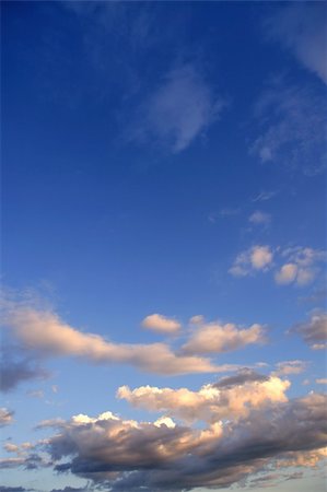 Blue sky background with clouds at sunset Stock Photo - Budget Royalty-Free & Subscription, Code: 400-05253282