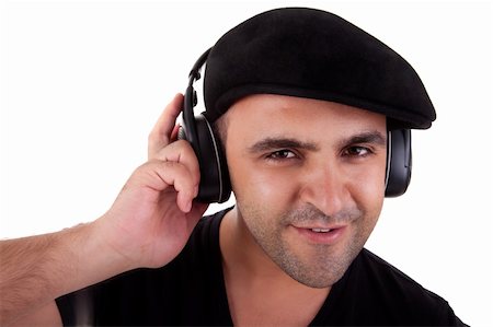man listening music in headphones and smiling, isolated on white background, studio shot Stock Photo - Budget Royalty-Free & Subscription, Code: 400-05253943