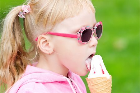 Little blond girl eating ice-cream Stock Photo - Budget Royalty-Free & Subscription, Code: 400-05253995