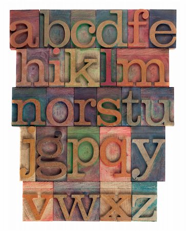 English alphabet (lower case) in vintage wooden letterpress type, stained by  inks of different colors, flipped horizontally, isolated on white Stock Photo - Budget Royalty-Free & Subscription, Code: 400-05265284