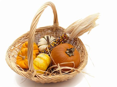 Ornamental small pumpkins and Indian corn in a basket with straw. White background for easy removal. Photographie de stock - Aubaine LD & Abonnement, Code: 400-05265309