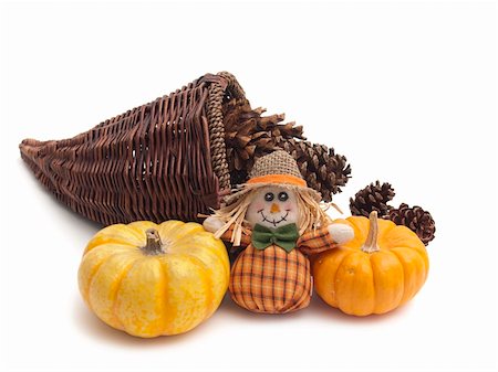 Collection of Fall objects for Thanksgiving or Halloween: cornucopia basket with pine cones; miniature pumpkins and scarecrow doll. All on white background. Photographie de stock - Aubaine LD & Abonnement, Code: 400-05265317