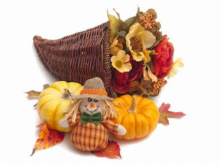 Cornucopia basket full of colorful silk flowers with ornamental pumpkins and scarecrow doll beside it. All on white background. Photographie de stock - Aubaine LD & Abonnement, Code: 400-05265311