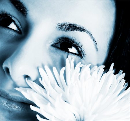 simsearch:400-08096297,k - Macro image of a girl face with a white flower Stock Photo - Budget Royalty-Free & Subscription, Code: 400-05265539