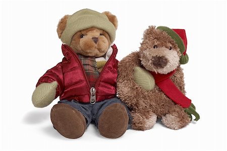 Isolated teddy bear couple sitting at white background. Two friends in inter clothing Foto de stock - Super Valor sin royalties y Suscripción, Código: 400-05265649