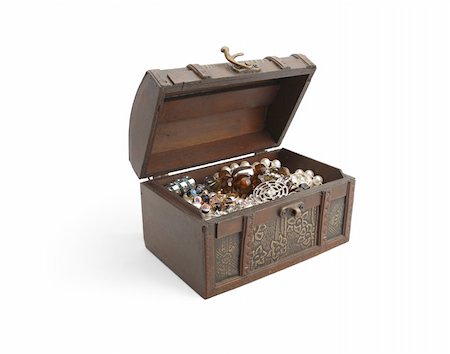 A wooden patterned casket  filled with jewelry half open. Isolated on white background Stock Photo - Budget Royalty-Free & Subscription, Code: 400-05265653