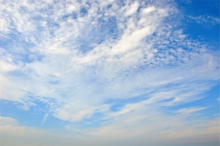 Fleecy clouds on blue sky Stock Photo - Budget Royalty-Free & Subscription, Code: 400-05266099