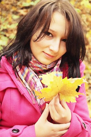 simsearch:400-07042487,k - Woman with the autumnal leafs in the pink coat Stock Photo - Budget Royalty-Free & Subscription, Code: 400-05266131